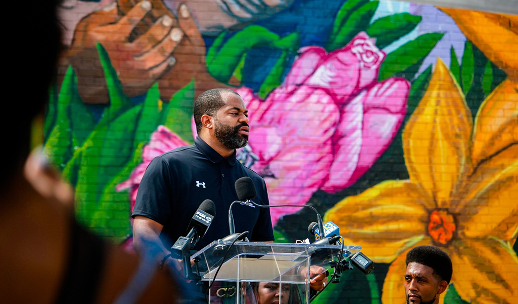 Council President Nick J. Mosby addresses community members at a mural unveiling in East Baltimore. 
